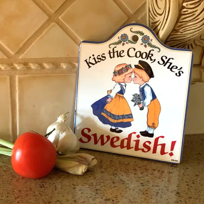 Kiss the Cook Swedish Decorative Cheeseboard available at American Swedish Institute.