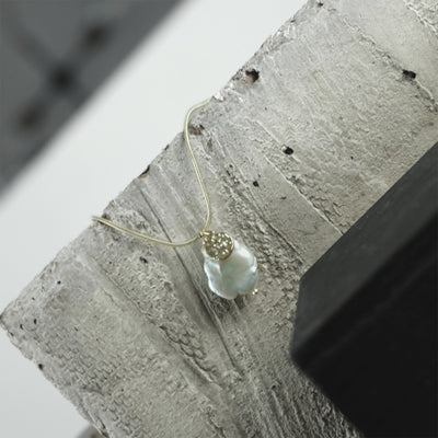 Audrey Gold Pearl Necklace - Dansk Copenhagen available at American Swedish Institute.