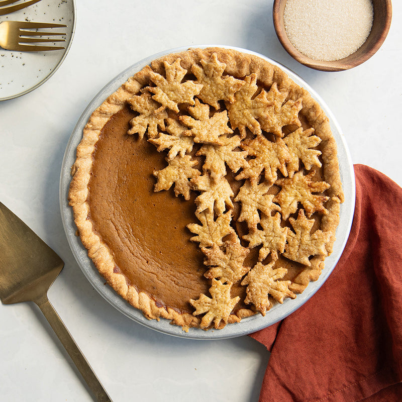 Nordic Ware 12 Inch Leaves & Apples Reversible Pie Top Cutter available at American Swedish Institute.