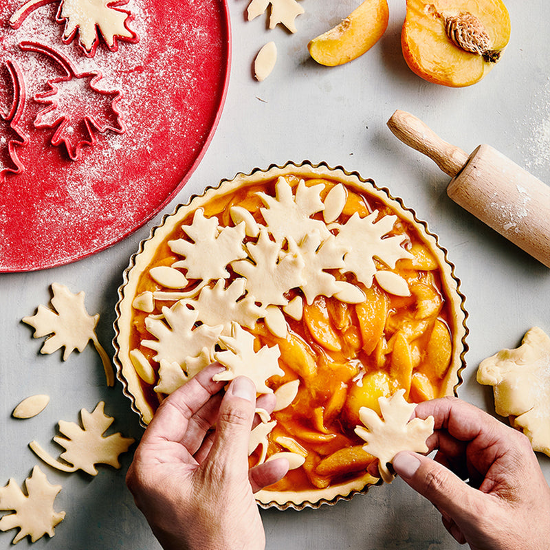 Nordic Ware 12 Inch Leaves & Apples Reversible Pie Top Cutter available at American Swedish Institute.