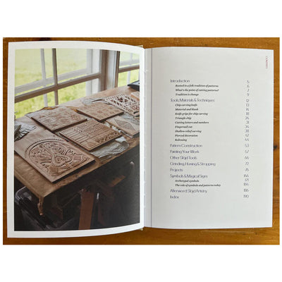 Karvsnitt: Carving, Pattern & Color in the Slöjd Tradition by Jögge Sundqvist available at American Swedish Institute.