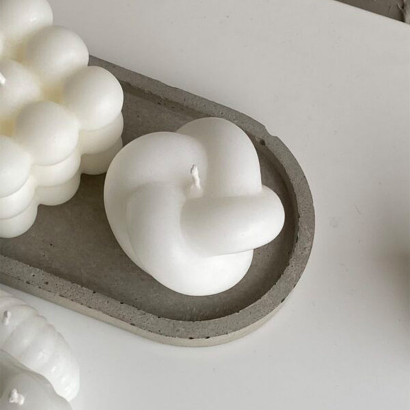 Knot Candle by veke available at American Swedish Institute.